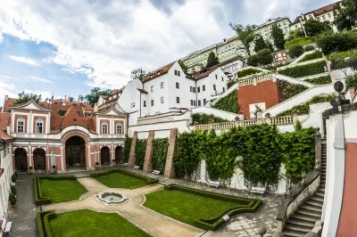 Golden Well Hotels near Franz Kafka - Rotating Head by David Cerny