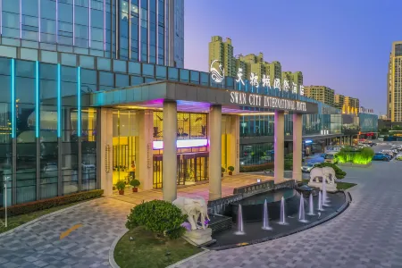 Swan City International Hotel Отели рядом с достопримечательностью «Huanghe Forest Park»