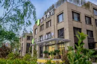 Pero Hotel (Qingdao Huangdao District Langyatai Road Qingdao Gaotie West Station) Отели рядом с достопримечательностью «Кунг Наньли Торговый Билдинг»