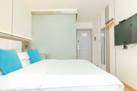 Homeinn Pebble Hotel (Fukang Old Bus Station) Отели в г. Фукан