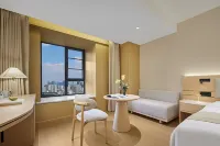 Zee Hotel Hotels in A red building/Pleasure City business district