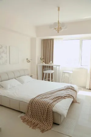 Tata Su Apartment (Harbin Ice and Snow World Sunac Land) Отели рядом с достопримечательностью «Heilongjiang Infotech Profession College (Xueyuan Road)»