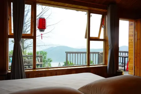 Yunshang Muliy Homestay Отели рядом с достопримечательностью «Zuyuancun»