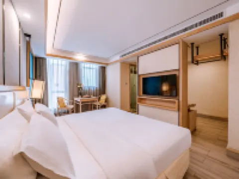 Lijiang ancient city Zangyuan snow mountain view hotel (big water wheel shop) فنادق في ليجيانغ