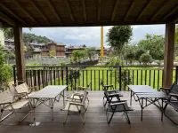Mangshi Mangli · Pf · Utop Design Guesthouse (Dai Ethnic Ancient Town) - servizio colazione
