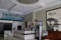 Q+ Nanxiong Xinhewan Business Hotel