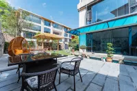 Enshi Tonghui Xiyuan Homestay - Bares