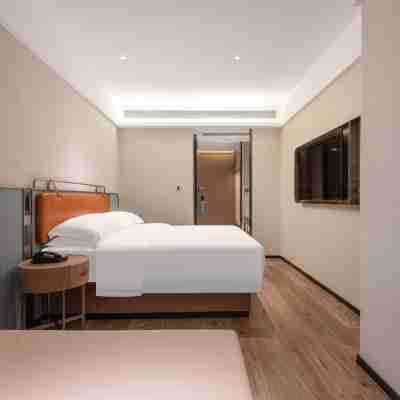 Phoenix Holiday Hotel (Xuefeng Plaza Branch), Dongkou County Rooms
