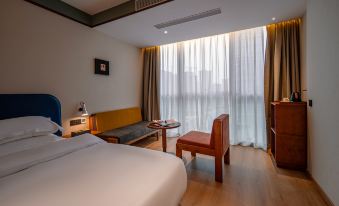 BLOOM BLUE Hotel (Leshan High-speed Railway Station Shihao Plaza)