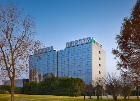 Haiyue Huan Tu Four Seasons Qingteng Hotel (Ningbo Hangzhou Bay New Zone) Отели в г. Циси