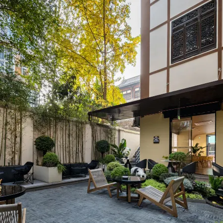 XISHU GARDEN INN Отели рядом с достопримечательностью «Монастырь Веньшу»