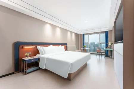 Meihao EZZI Hotel (Jinan Olympic Sports Center Wanxiangcheng) Отели рядом с достопримечательностью «Shandong Technician Institute Yanshan Campus»