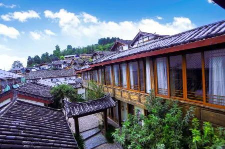 Mulanyu Tangsu Hotel Отели в г. Лицзян