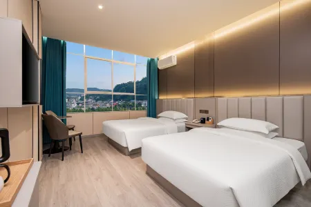 Xuan En Qingxin Yayuan Hotel (Wetland Park Store) Отели рядом с достопримечательностью «Wenlan Bridge»