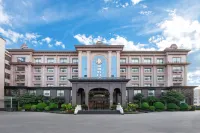 Xingang Holiday Hotel(Xinzheng International Airport Shop) Hotel in zona Aeroporto di Zhengzhou-Xinzheng