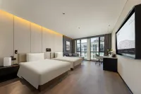 โรงแรมเอทัวร์ สถานีรถไฟไป่เฉิง ย่าจางเทียนเจี๋ย ซานหนาน