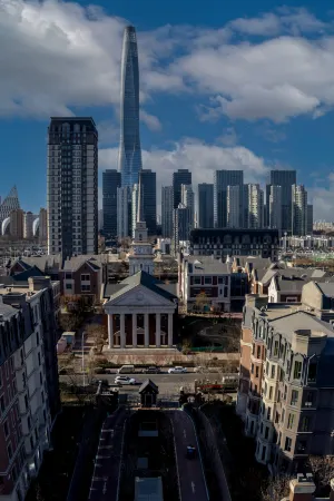 Seven International Service Apartment (Tianjin Binhai New Area Teda MSD Store) Отели рядом с достопримечательностью «Taida Financial Plaza E3AB»