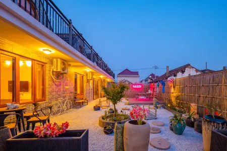 Floral Hotel · Yiding Country House Hotel Отели рядом с достопримечательностью «Chongming Xunyicao Theme Park»