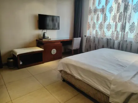 Rujia Huayi Hotel (Liaoyuan Dongfeng County Pedestrian Street Branch) Отели в г. Дунфэн