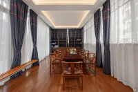 Mijng Qiyuan Minority Theme Hotel - parking