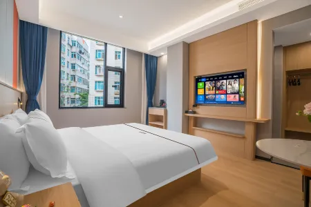 Tiangcheng Hotel (Tongde Plaza) Отели рядом с достопримечательностью «Kunming Waterfall Park»