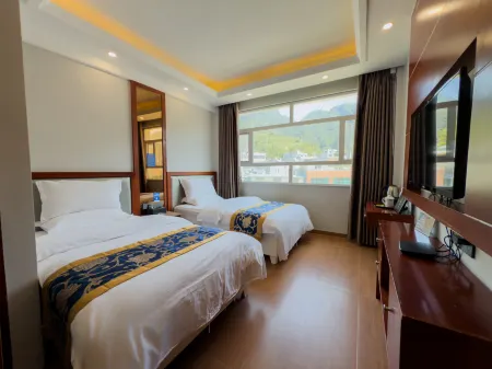 Feifeng Chuanqi Hotel Отели в г. Хечжан