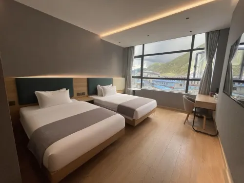 Huayi Business Hotel Hotels in Baqen