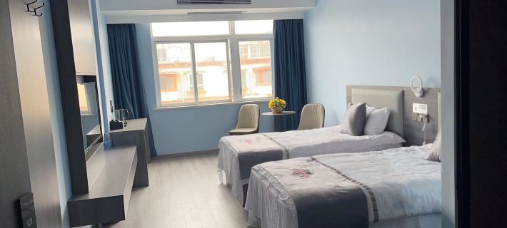 Fuyang Xinjia Business Hotel โรงแรมในจองหยาง