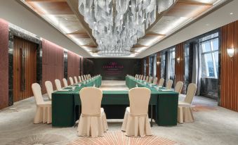 A spacious room is arranged with tables and chairs for hosting events or private dining at Crowne Plaza Guangzhou City Centre
