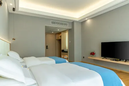 Zhiyuan International Hotel Отели рядом с достопримечательностью «Yunnan Minzu University (Yuhua Campus)»