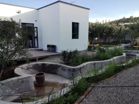 Ku'erdening Caiwei Cottage Homestay Отели рядом с достопримечательностью «Kurding Tourism and Cultural Museum»