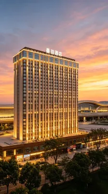 曼珀·輕奢全景飯店（黔西高鐵站黔西一中店） - 停車場