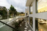 Xishuangbanna Qixuju Yishu Resort Hotel Hotels in Poshui Plaza