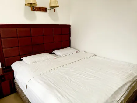 Wusheng Hexin Business Hotel Отели в г. Вушен