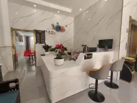 Zhaotong Dongjia Hotel (Jinhai Building Materials City)