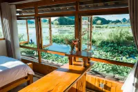 Puzhehei Riverside Inn - Parkplatz