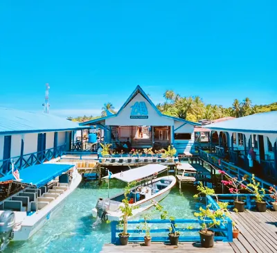 Amina Holidays Hoteles cerca de Isla Mabul