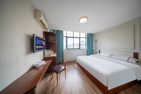 Zhujicheng Theme Hotel Отели рядом с достопримечательностью «Zhuji Gymnasium»