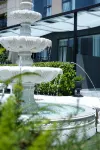 THELILY莉莉飯店（重慶南濱路長嘉滙店） 重慶光環購物公園室內植物園“沐光森林”附近的飯店