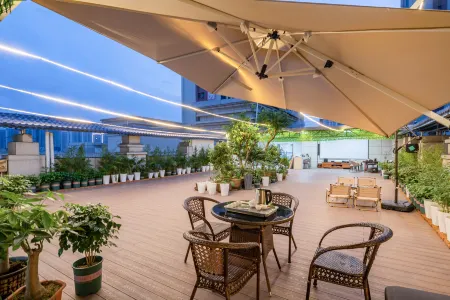 Urban Garden Hotel (Shaoguan Qujiang) Отели в г. Шаогуань