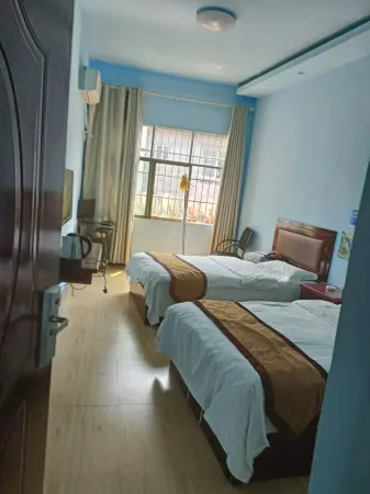 Luodian Longmen Inn Отели рядом с достопримечательностью «Mingzhu Center Square»