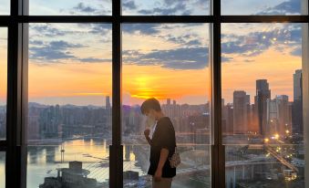The view from the top floor offers a panoramic cityscape, showcasing the city and its skyline through large windows at ISEYA HOTEL Chaotianmen Chongqing