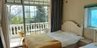 Youyang Meiju Homestay - Sunshine Family Family Room (Balcón)