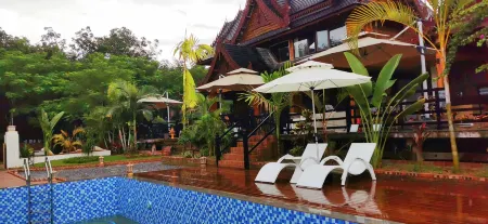 Xishuangbanna Jinghong Fanhua·Zhijing Holiday Courtyard Отели рядом с достопримечательностью «Menghanman Tingfota Temple»