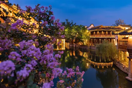 Puyuan fashion ancient town theme inn Отели в г. Тунсян