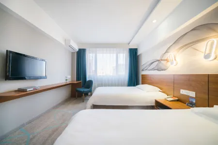 Mudanjiang Jili Hotel (Train Station Department Store) Отели рядом с достопримечательностью «Heilongjiang Child Normal University Gaodeng Zhuanke School»