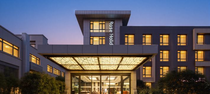 Rose Holiday Hotel Отели в г. Жунчэн