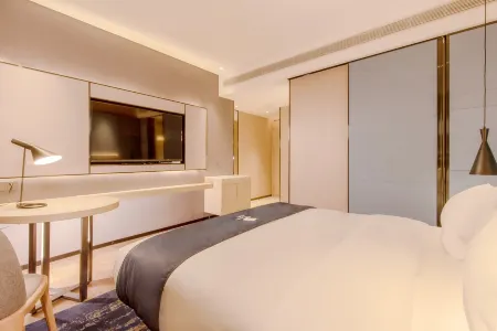 Echarm Hotel (Guangxi Sports Center Wuxiang Hangyangcheng) Отели рядом с достопримечательностью «Guangxi Electric Power Vocational and Technical College (Wuxiang Campus)»