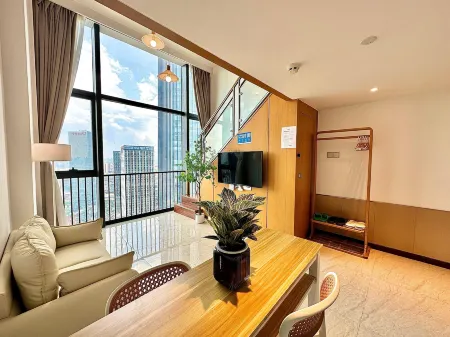 Weixiangwu  Apartment (Hanxi Changlong Wanbo Tianhe City store) Отели рядом с достопримечательностью «Guangzhou Vocational College of Technology & Business»