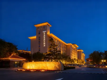 Blue Horizon International Hotel Отели рядом с достопримечательностью «Huanghe Sanjiaozhou Zoo»